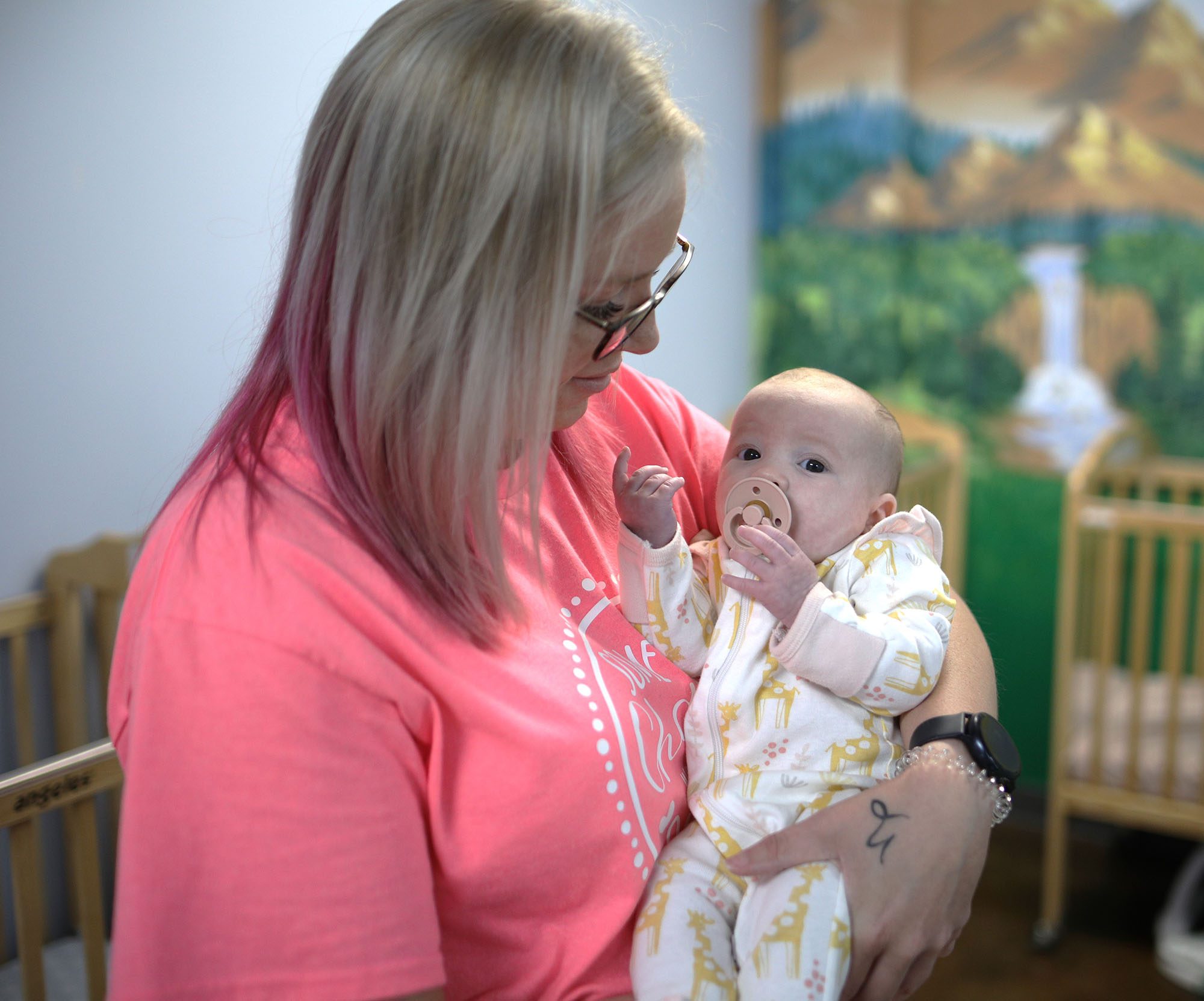 CCAV staff holding an infant
