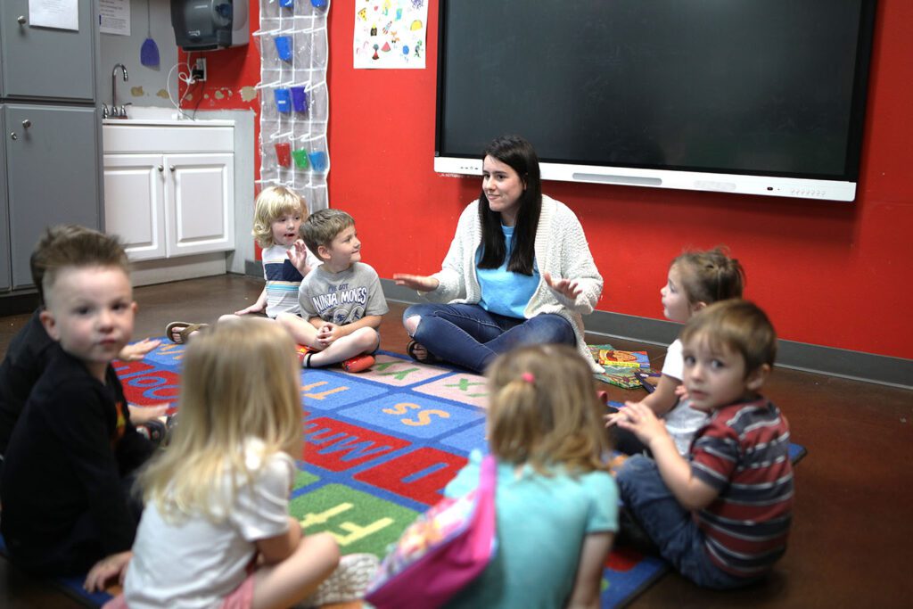 Teacher and children in circle during story time